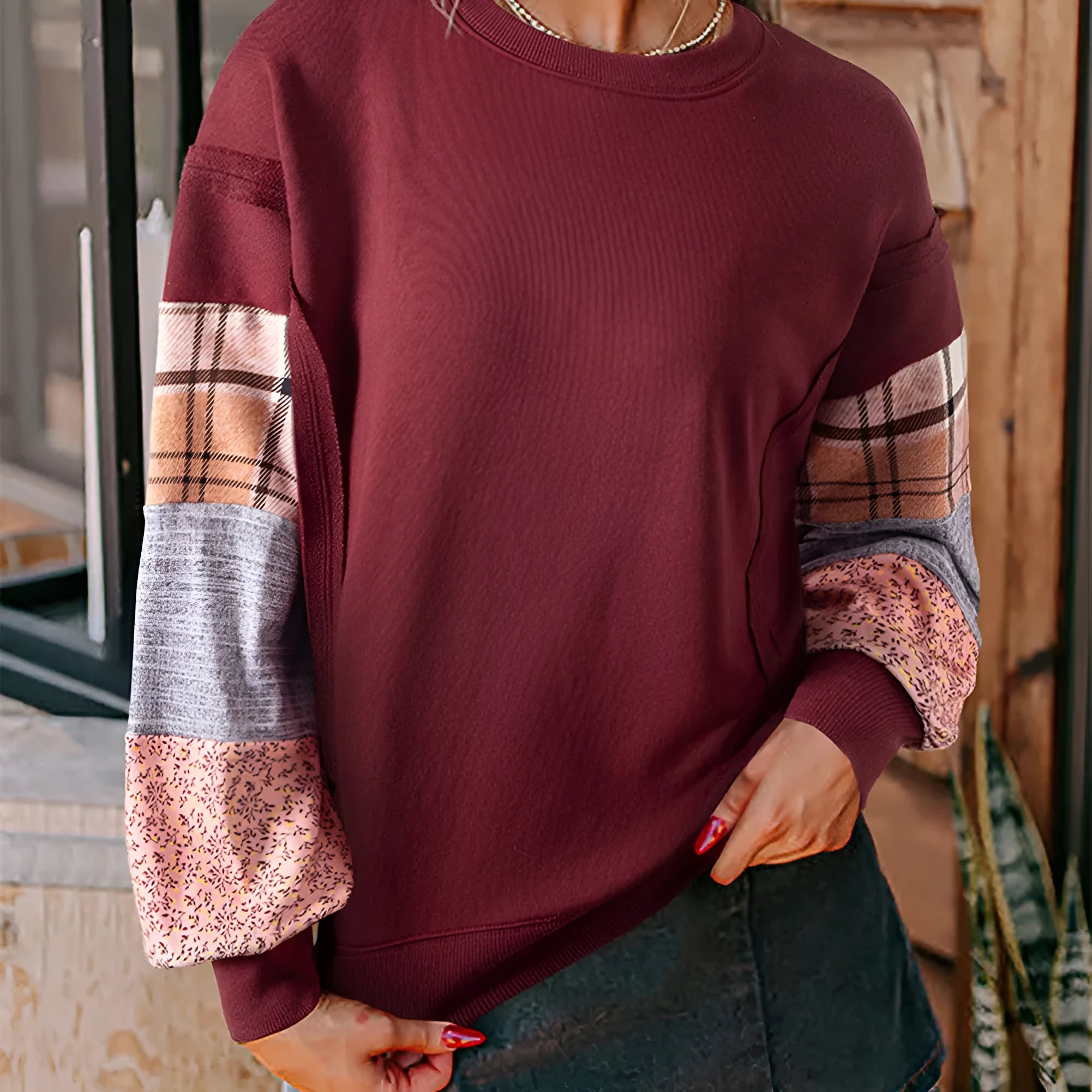 Women's loose fit long sleeve top with plaid stripe pattern stitching in apricot colour