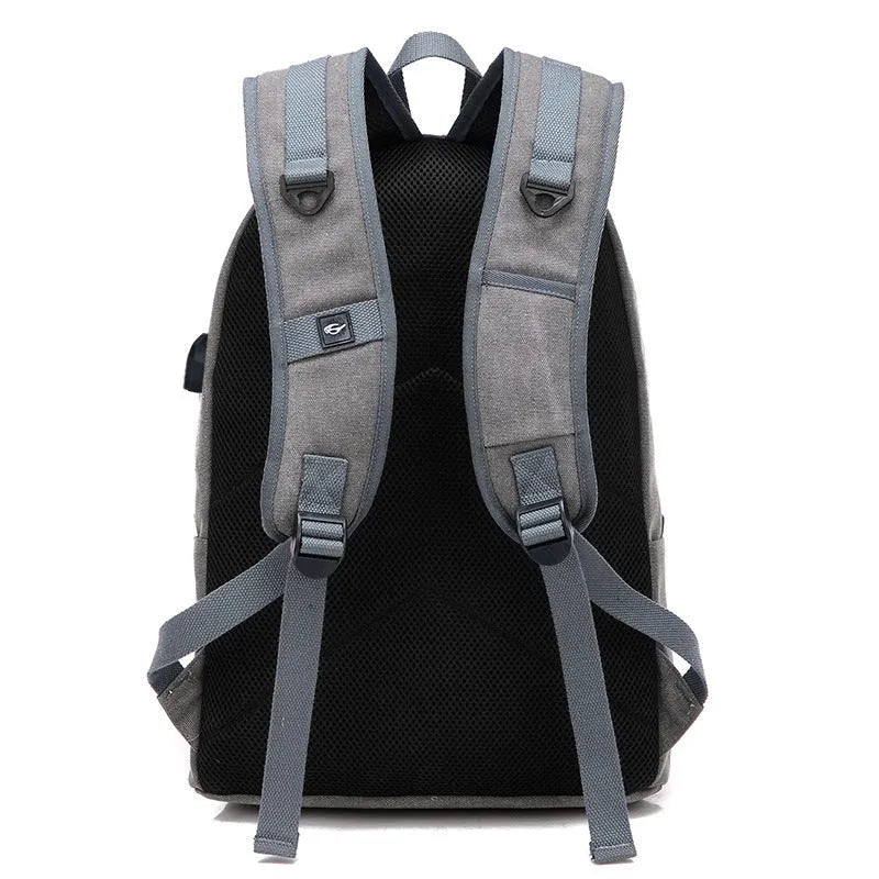 Canvas USB rechargeable backpack in coffee colour showing laptop pocket and zipper compartment