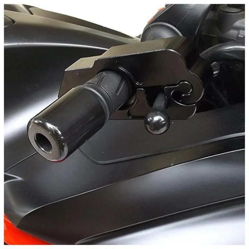 Black CNC aluminium motorcycle handlebar lock with key inserted, on a motorcycle brake lever