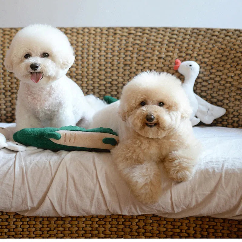 Green plush toy dog soft stuffed animal on white background.