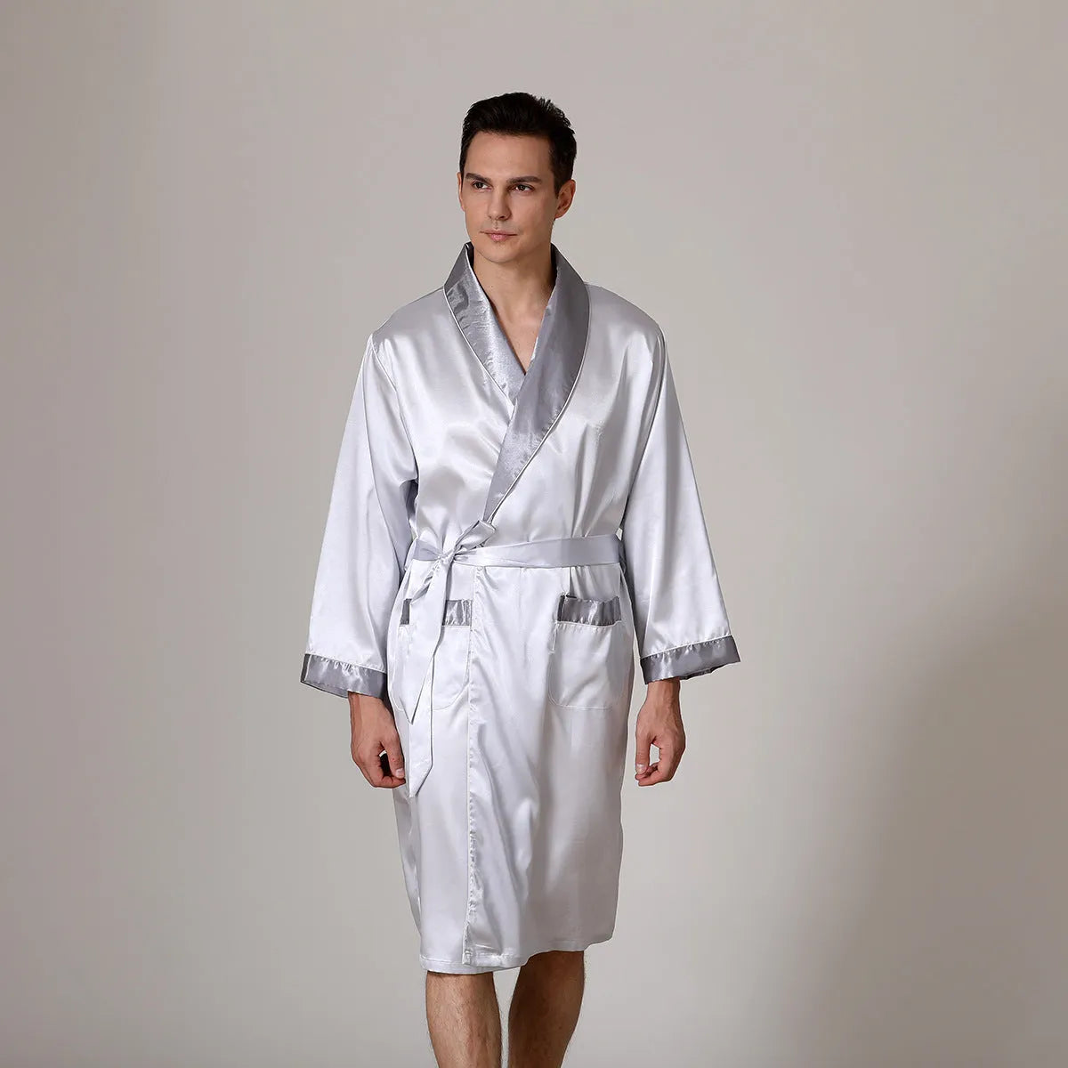 Man in a lightweight grey striped silk bathrobe for summer home lounging.