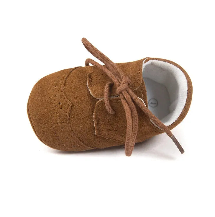 Vintage style baby shoes with soft soles in black synthetic leather