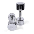 Silver pure steel dumbbell with ergonomic handle on a plain background