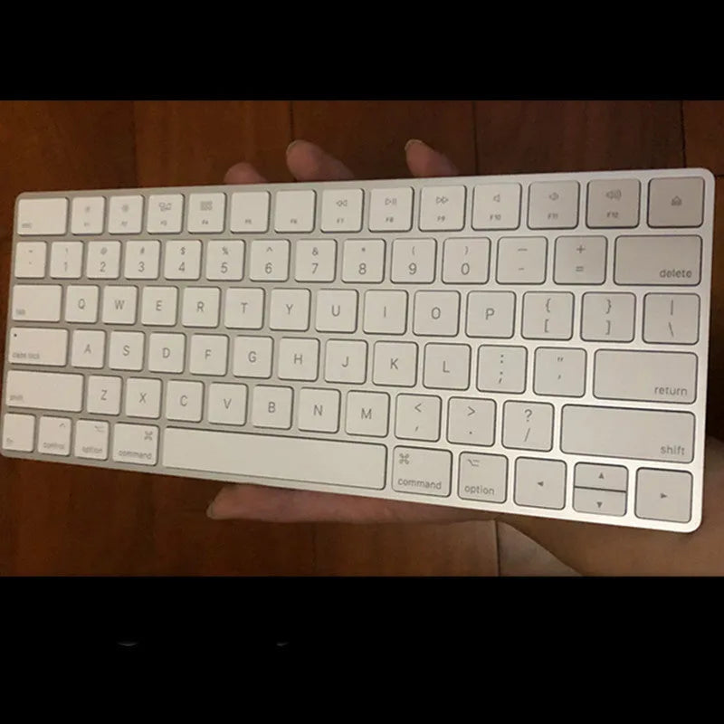 White Apple G6 ultra-thin aluminium Bluetooth wireless keyboard on a desk.