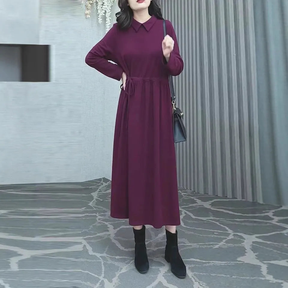 Purplish red plus size women's dress with extra long sleeves and a long skirt for autumn and winter office wear.