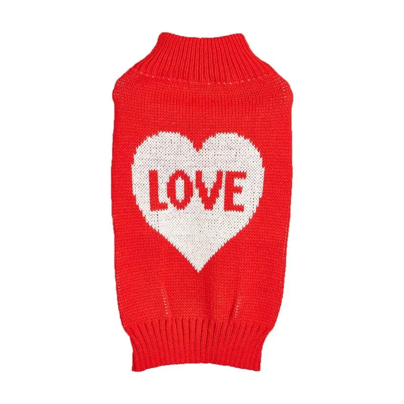 Dog wearing red love heart and pink bow decorated acrylic sweater