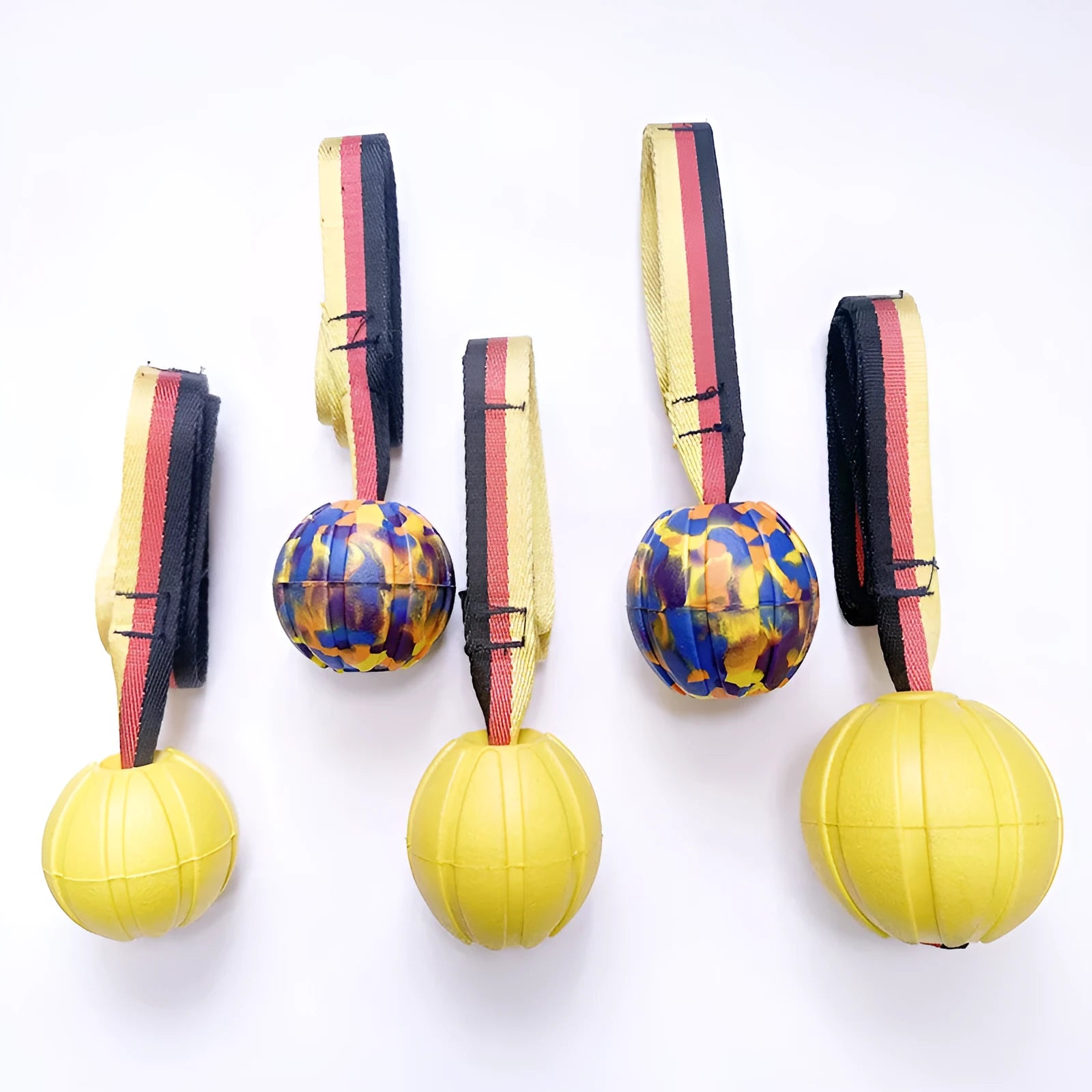 EVA floating tetherball dog toy in camouflage and yellow colours showing three diameter sizes