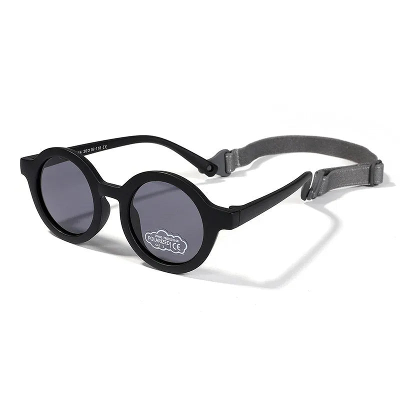 Round frame polarised sunglasses for toddlers aged 0-3 years with UV400 protection, shown in multiple colour options.