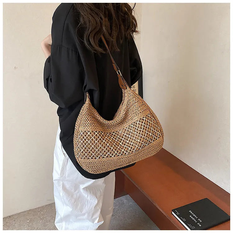 Women's straw cross body bag with horizontal square shape in khaki colour showing sandwich pocket design