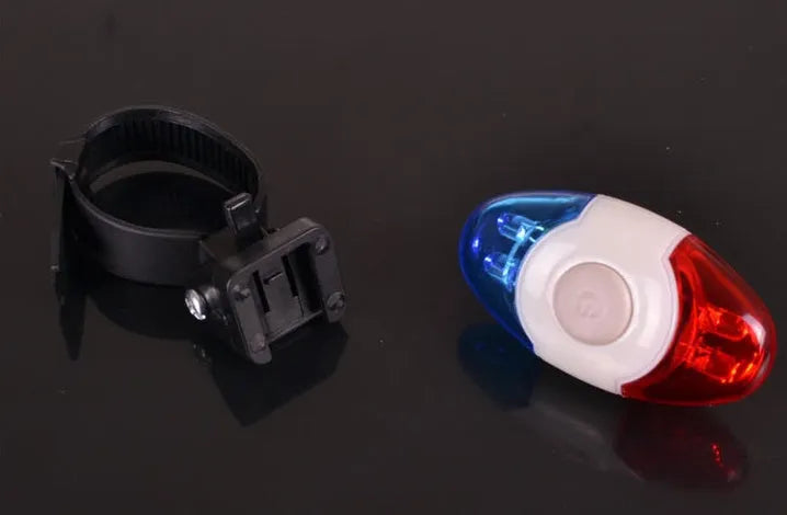 Red and blue LED bicycle tail light with adjustable mounting base shown in horizontal and vertical positions.