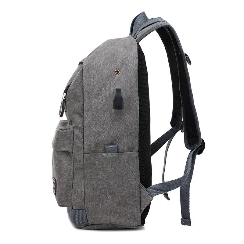 Canvas USB rechargeable backpack in coffee colour showing laptop pocket and zipper compartment