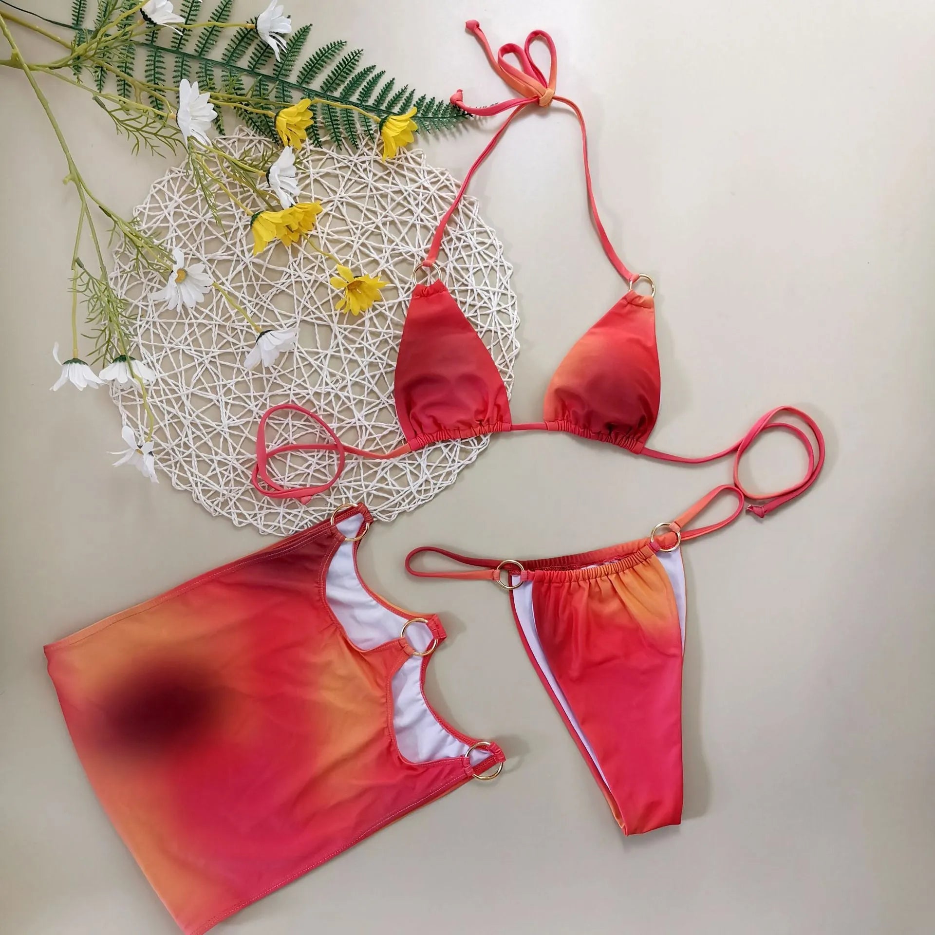 Solid colour tie-dye gradient three-piece halter bikini swimsuit set with top, pants, and skirt.