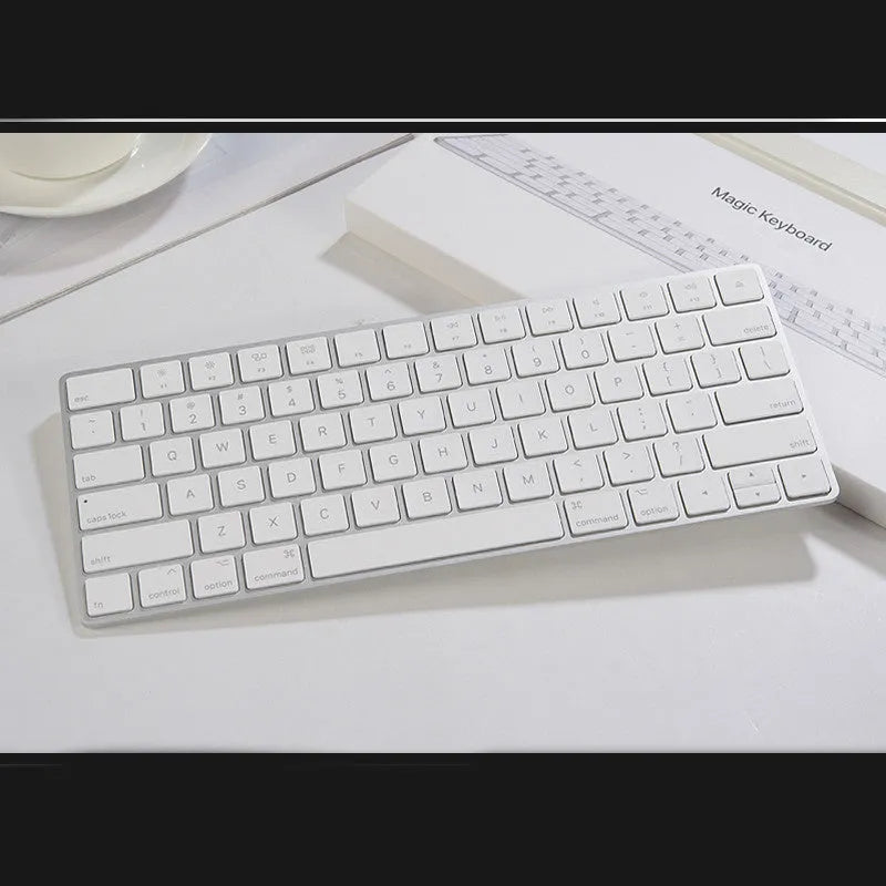 White Apple G6 ultra-thin aluminium Bluetooth wireless keyboard on a desk.