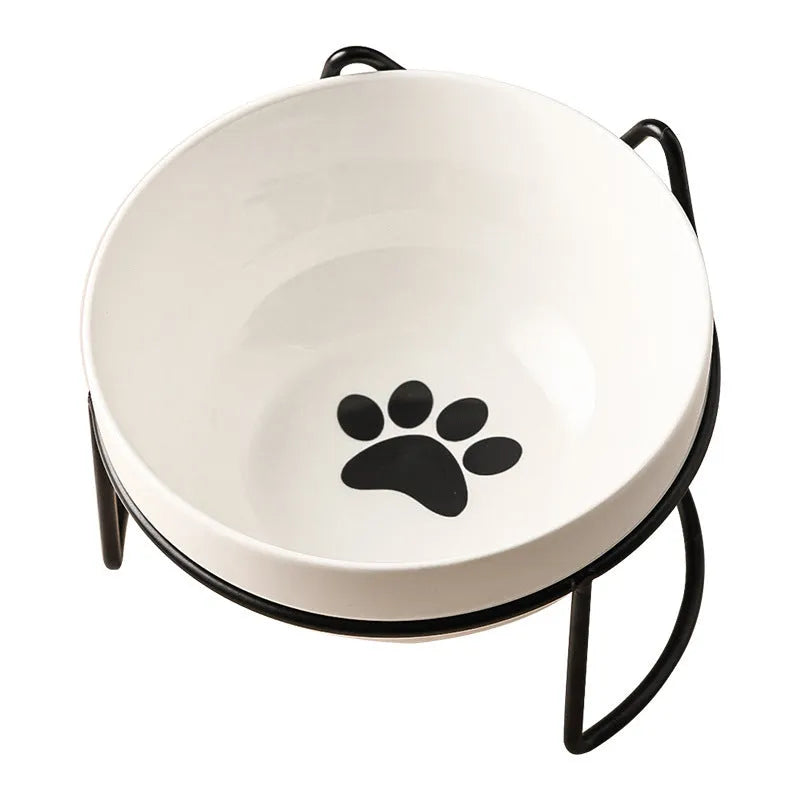 White ceramic cat bowl with decorative iron frame in cat footprints or fishbone design