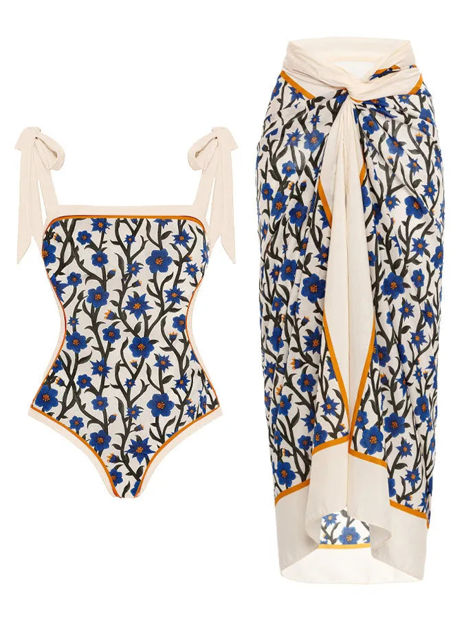 Women's printed two-piece chiffon swimsuit with matching hip skirt in a floral design.
