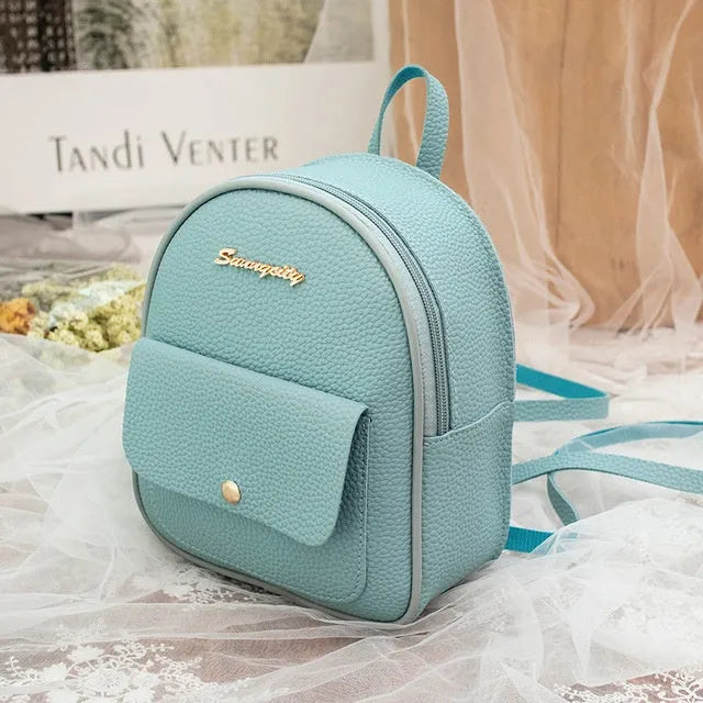 Women's small PU shoulder backpack 18.5cm length in black, blue, grey, pink, or red with zipper closure