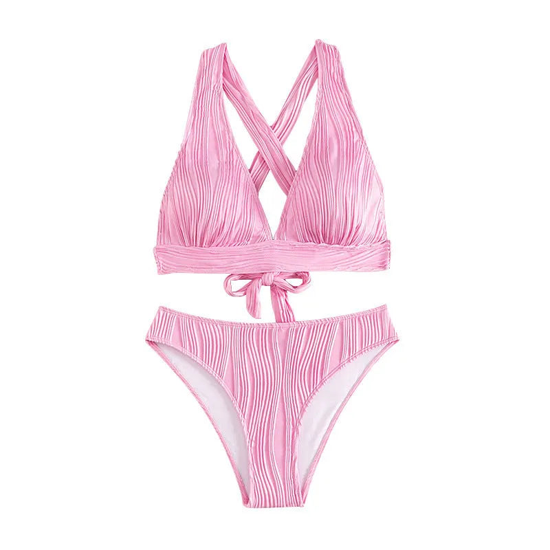 Women's halter strap split swimsuit bikini set in black with shorts and top on white background