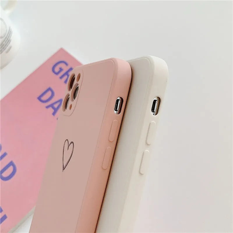 Solid colour silicone TPU back cover case for Apple iPhone on a table.