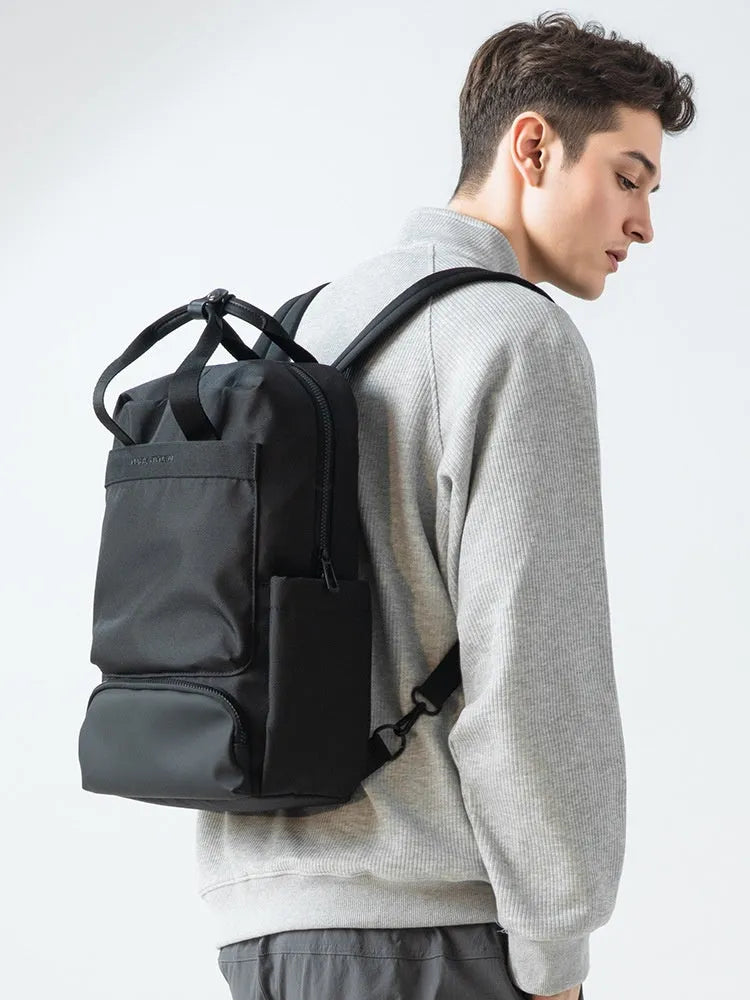 Lightweight black oxford cloth computer backpack with a 20-35 litre capacity.