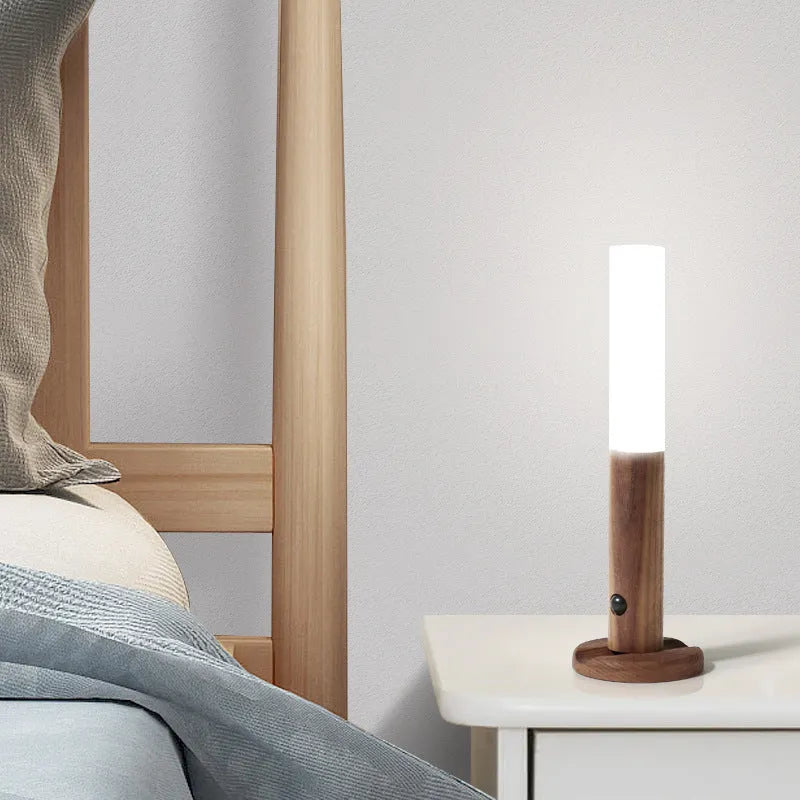 Smart sensor LED desk lamp made of solid wood and organic glass on a wooden desk