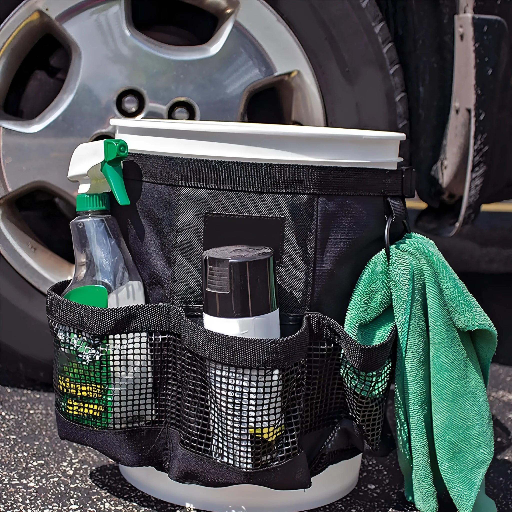 Black cylindrical hanging storage bag for 5 gallon barrels, car washing tools, and fishing tackle