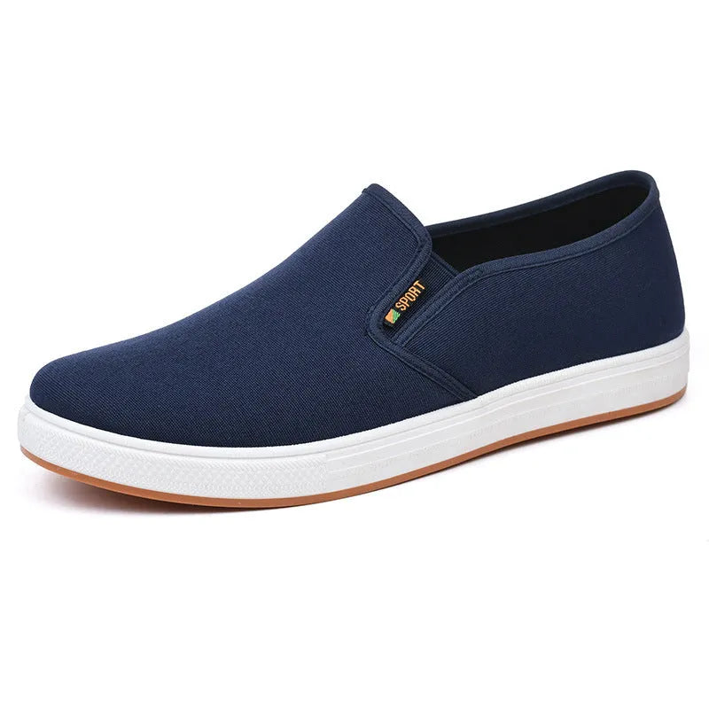 Men's low-top black and blue canvas slip-on shoes with round toe and shallow cut.