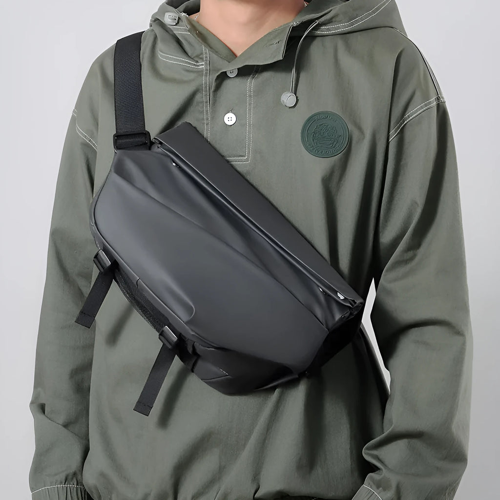 Grey horizontal square PU leather crossbody bag for men with a single shoulder strap.