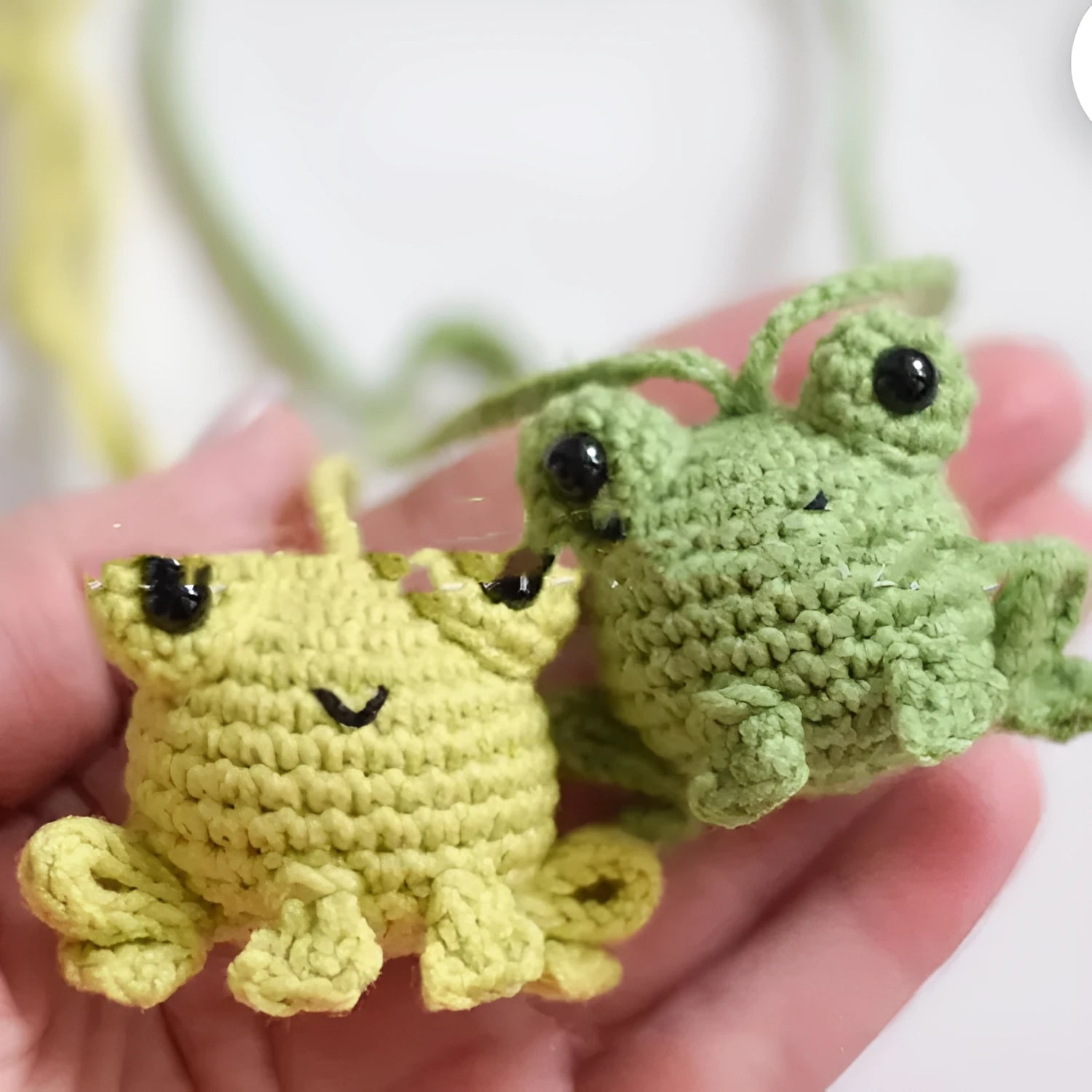 Green handmade plush woven frog car pendant hanging, showing its 15cm length and cartoon style.