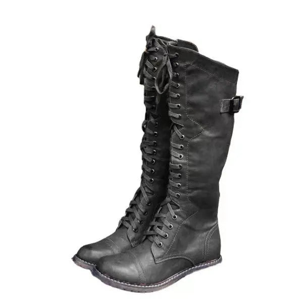Women's black chunky heel high-leg casual boots with a round toe and rubber sole.