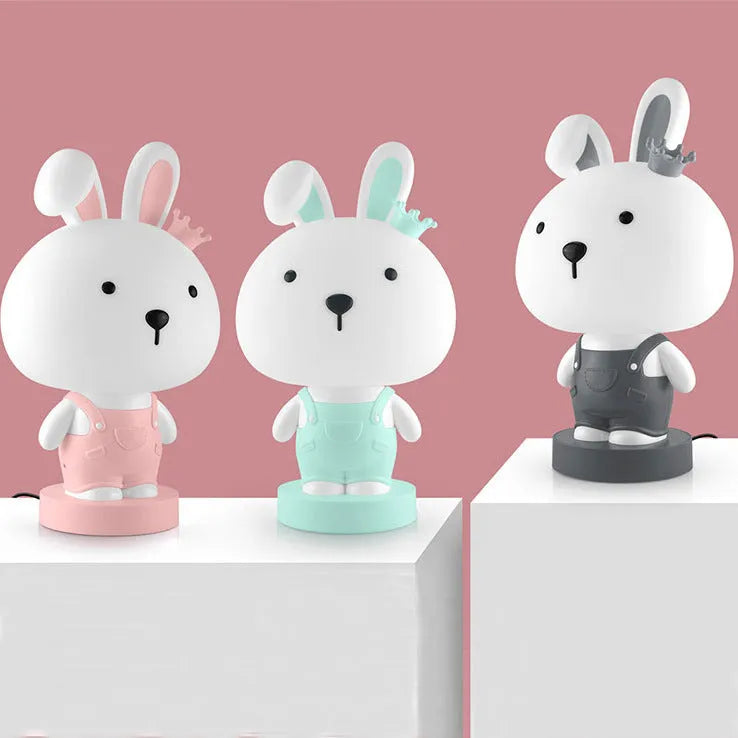 A plastic cartoon animal table lamp in a bear, cattle, rabbit, or tiger design with an LED light.