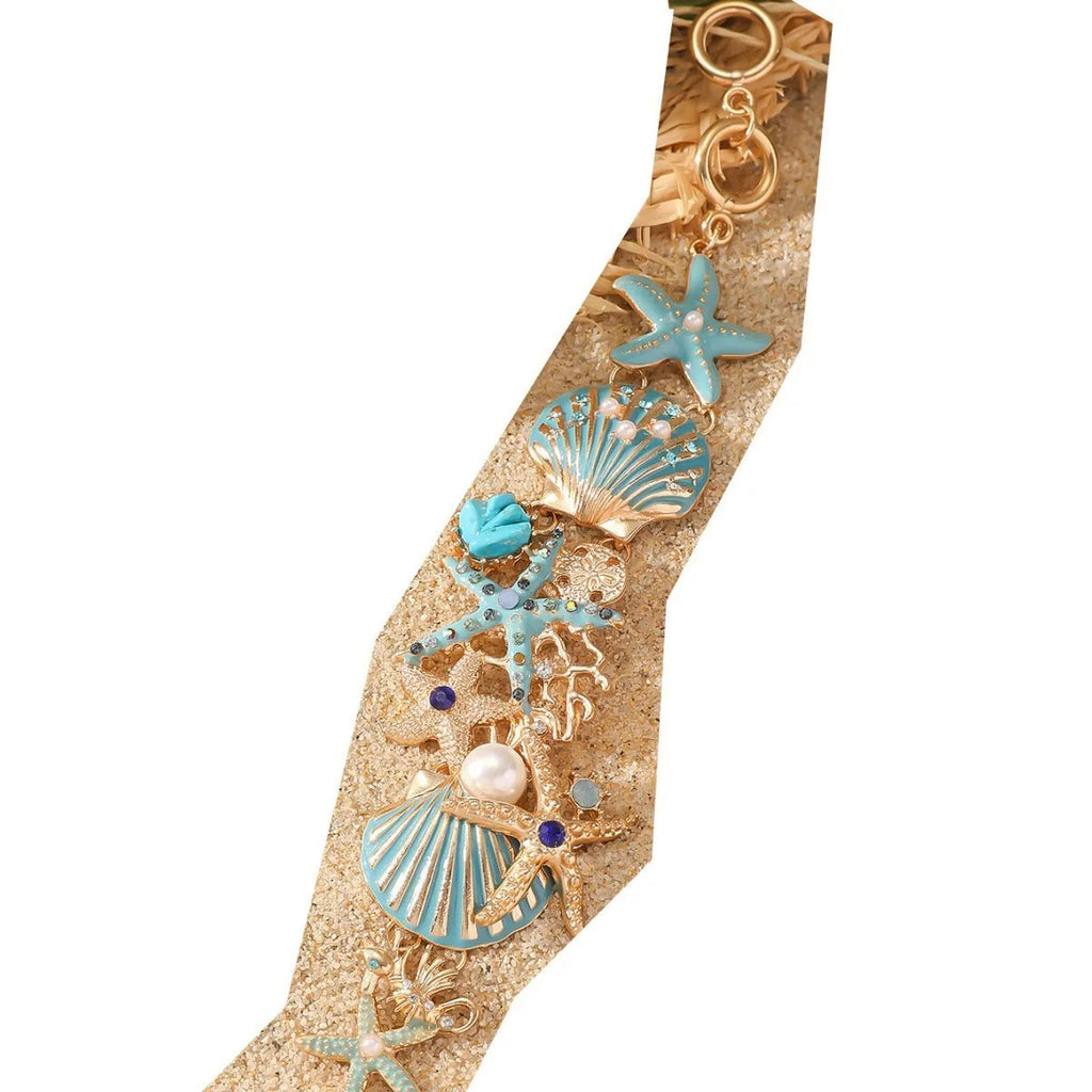 Women's alloy bracelet with a boat anchor charm, starfish, and rhinestones in turquoise, red, or blue.