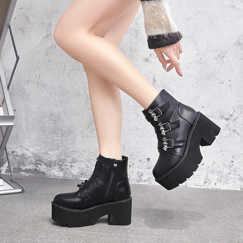 Black women's punk ankle boots with bat buckle and side zip closure