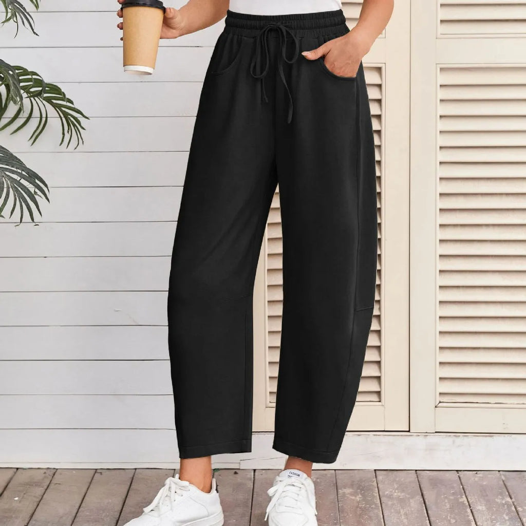 Loose-fit cropped sweatpants with drawstring waistband and side pockets in multiple colour options