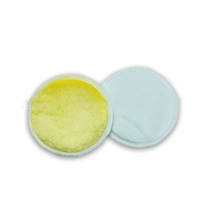 Set of pink and blue velvet makeup remover pads next to an organic cotton drawstring mesh bag.