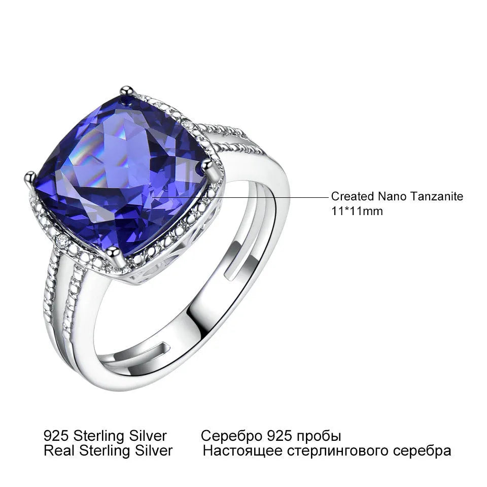 Blue Tanzanite gemstone sterling silver ring on white background showing band detail
