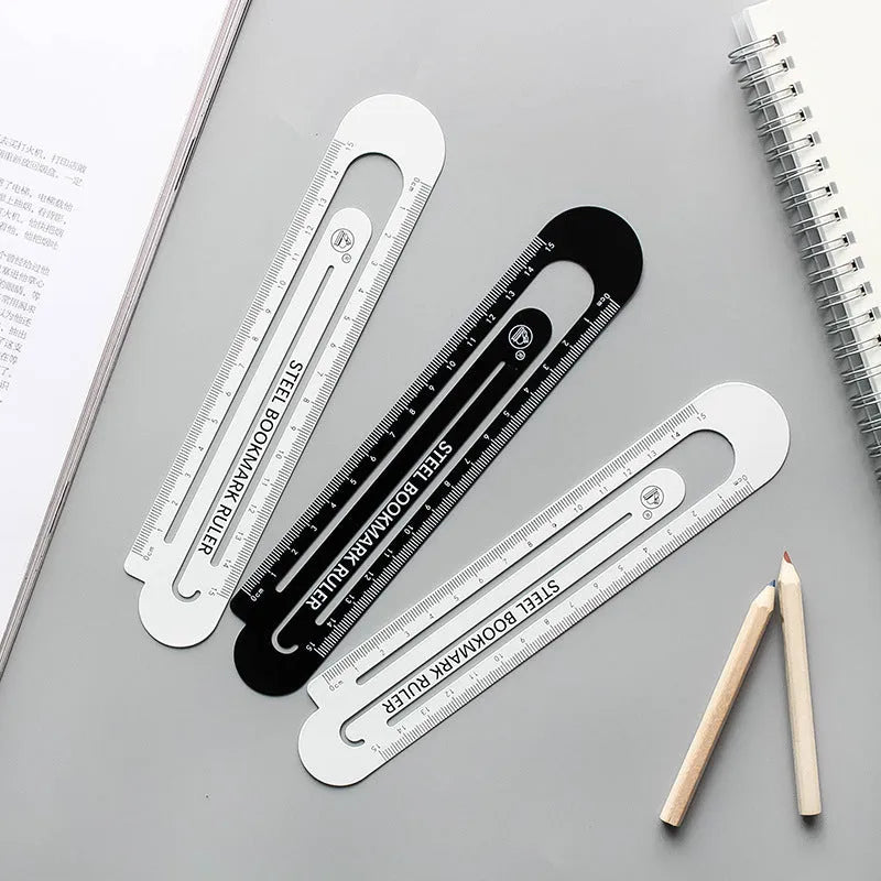 Black and white two-sided ruler 12cm long on white surface
