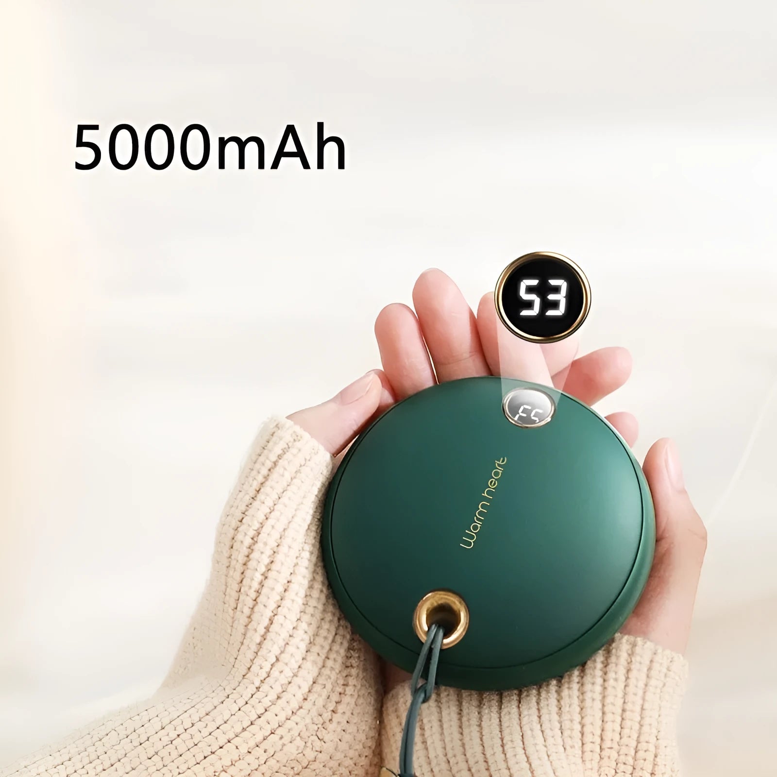 Green portable power bank with hand warmer function showing digital display and Type-C port