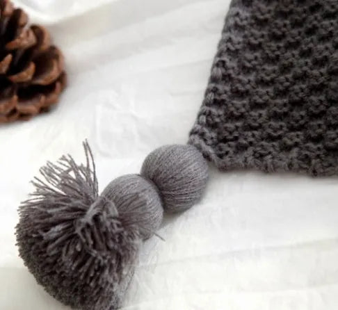 Acrylic knit ball blanket in beige colour, measuring 130 by 170 centimetres, laid flat.