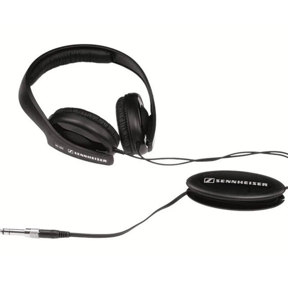 Black wired head-mounted monitor headphones with attached microphone and 3.5mm plug on white background