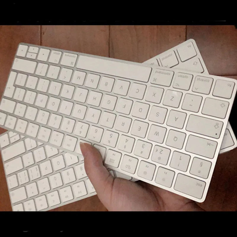 White Apple G6 ultra-thin aluminium Bluetooth wireless keyboard on a desk.