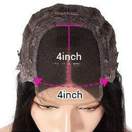 A woman wearing a real human hair lace front headgear with a 4x4 lace construction and long, styled hair.