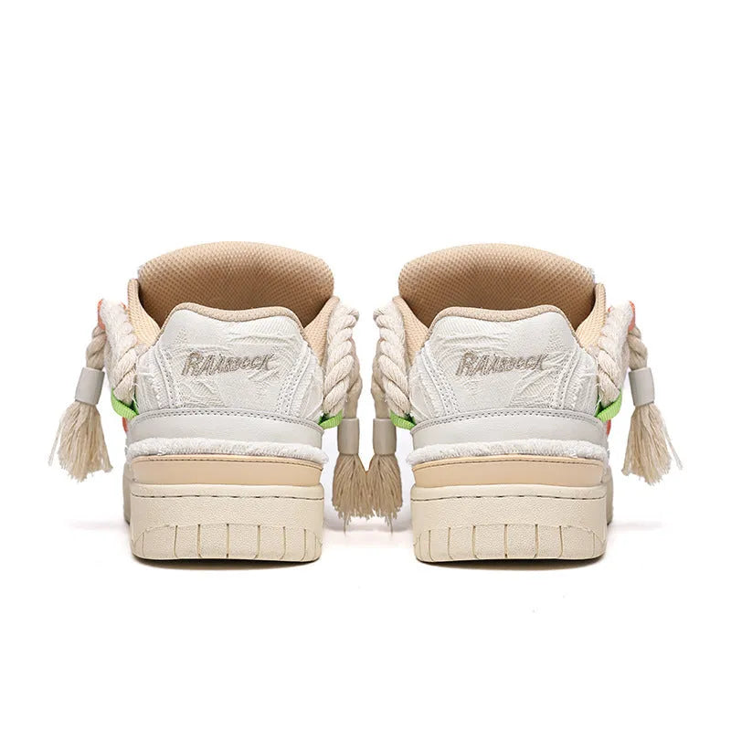 Old Damage brand creamy white retro skate shoes with low platform heel and lace-up front.