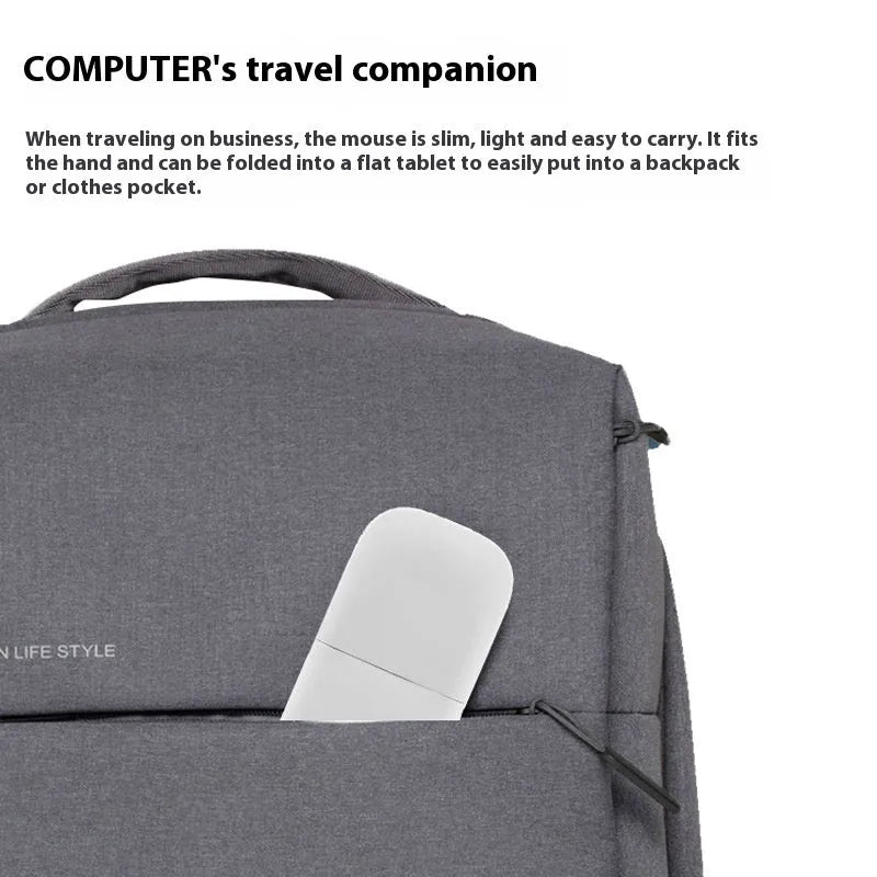 Black folding Bluetooth wireless touch mouse shown in open and closed positions next to a laptop.