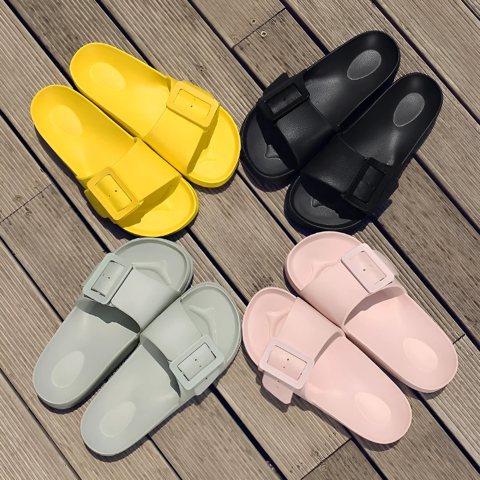 Women's grey blue EVA slippers with an adjustable silver buckle on the strap.
