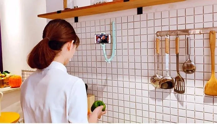 Flexible black phone holder with bendable arm and suction cup mount showing 360-degree rotation