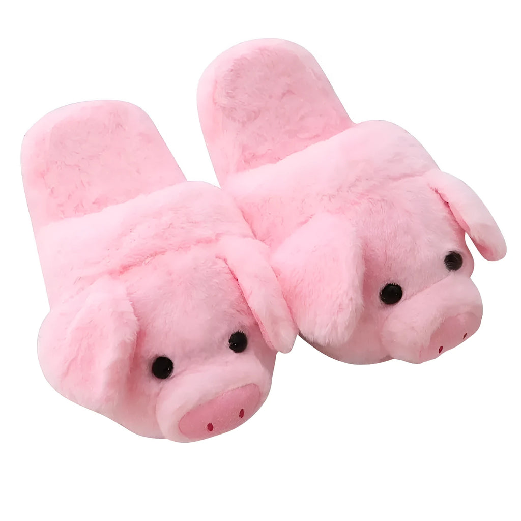 Pink pig floor slippers with plush lining shown on clean indoor surface