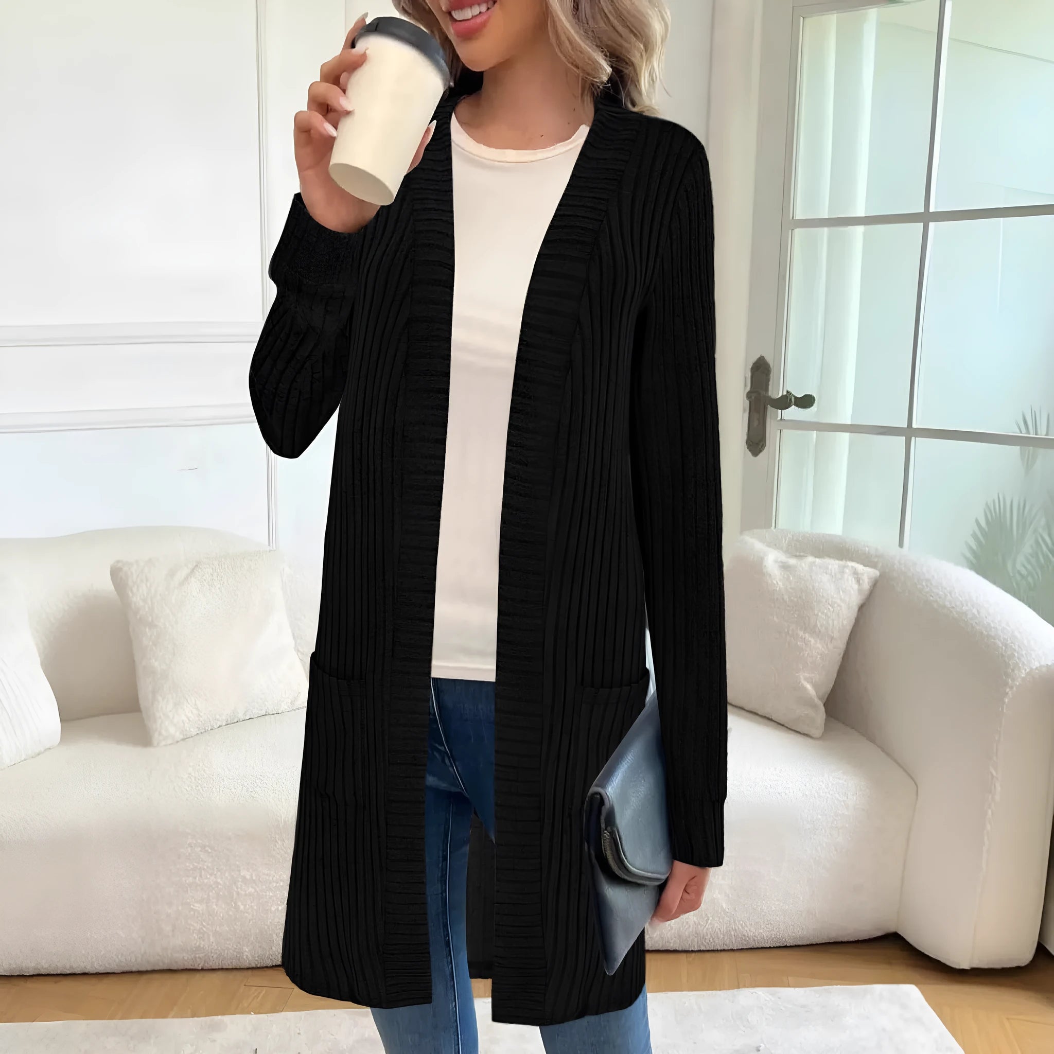 Long sleeve loose grey knitted cardigan jacket with pockets on a hanger