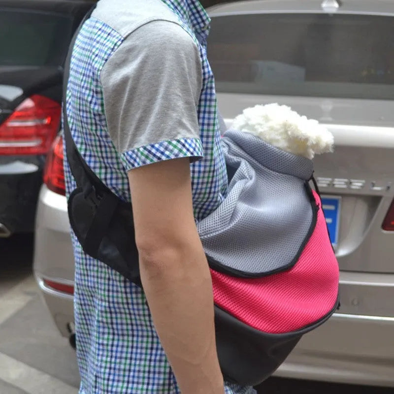 Blue polyester pet backpack for a cat showing shoulder straps and mesh ventilation.