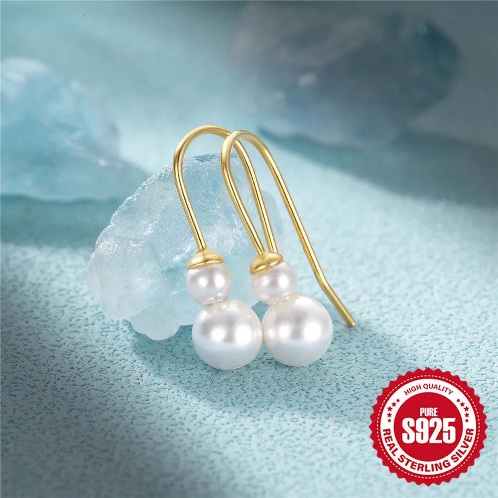 S925 sterling silver earrings with a geometric sunflower design and inlaid zircon stones in a golden colour.