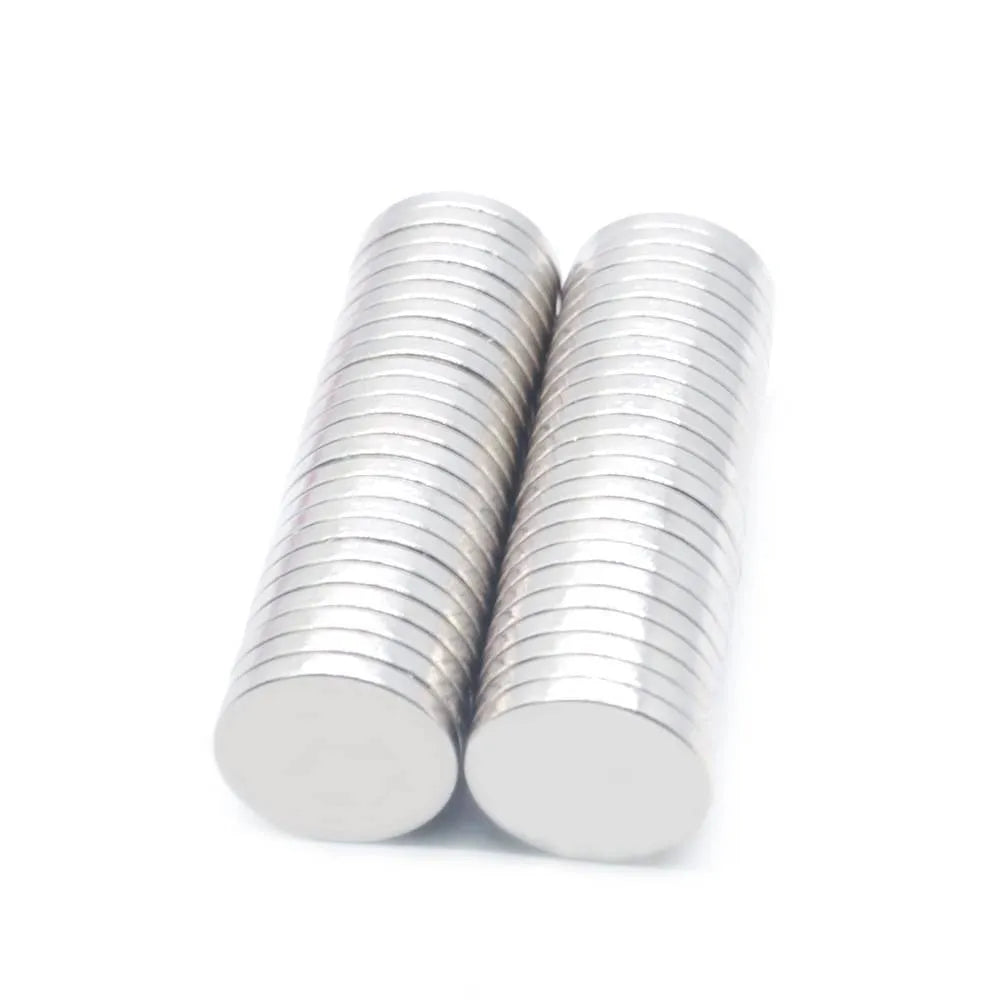Silver NdFeB disc magnet 14mm diameter 2mm thickness on white background
